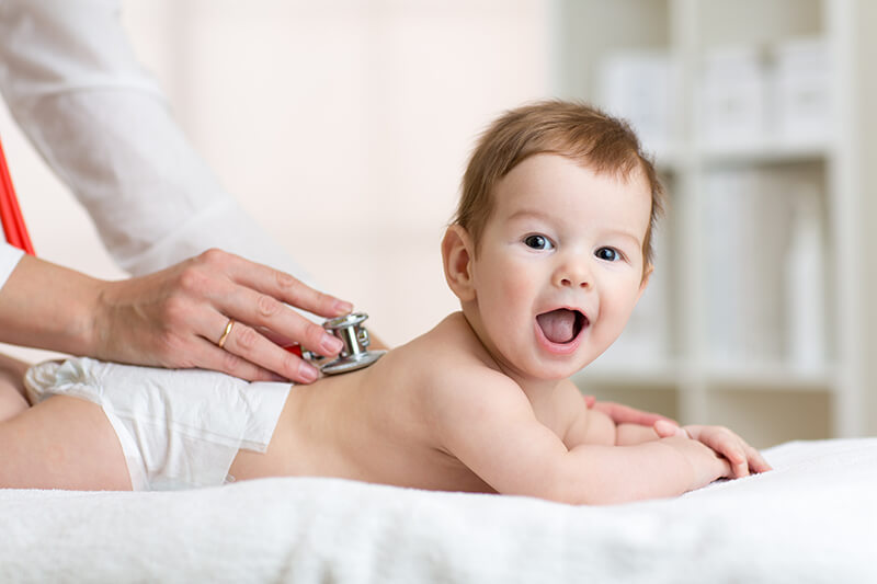 pediatrician treating baby